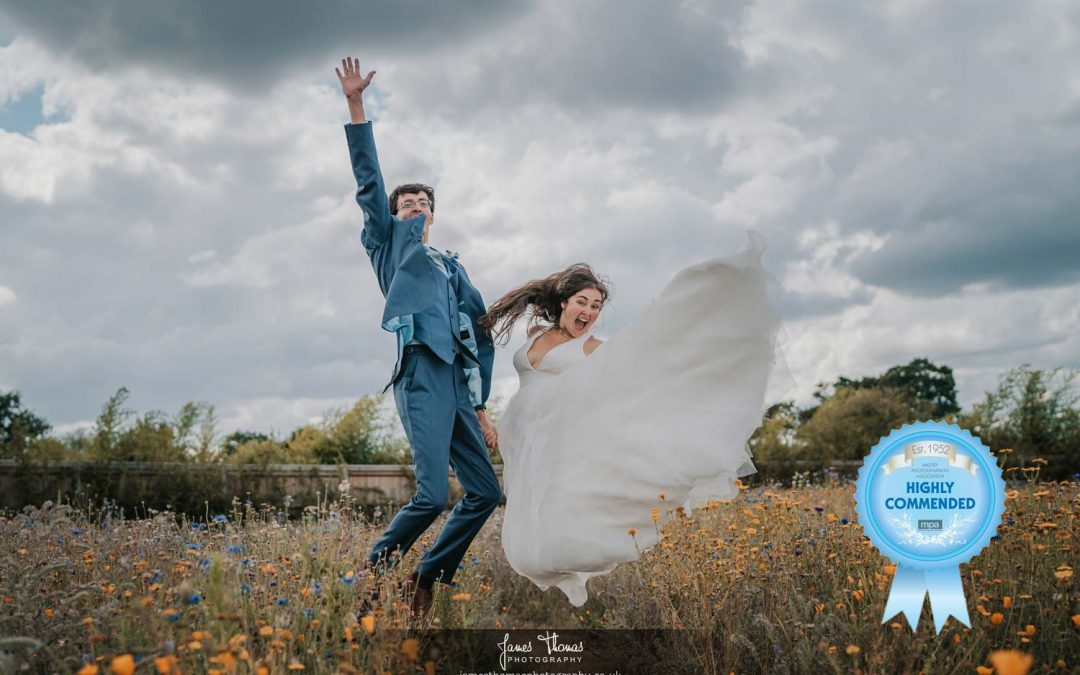 Bride and groom jumping in the air
