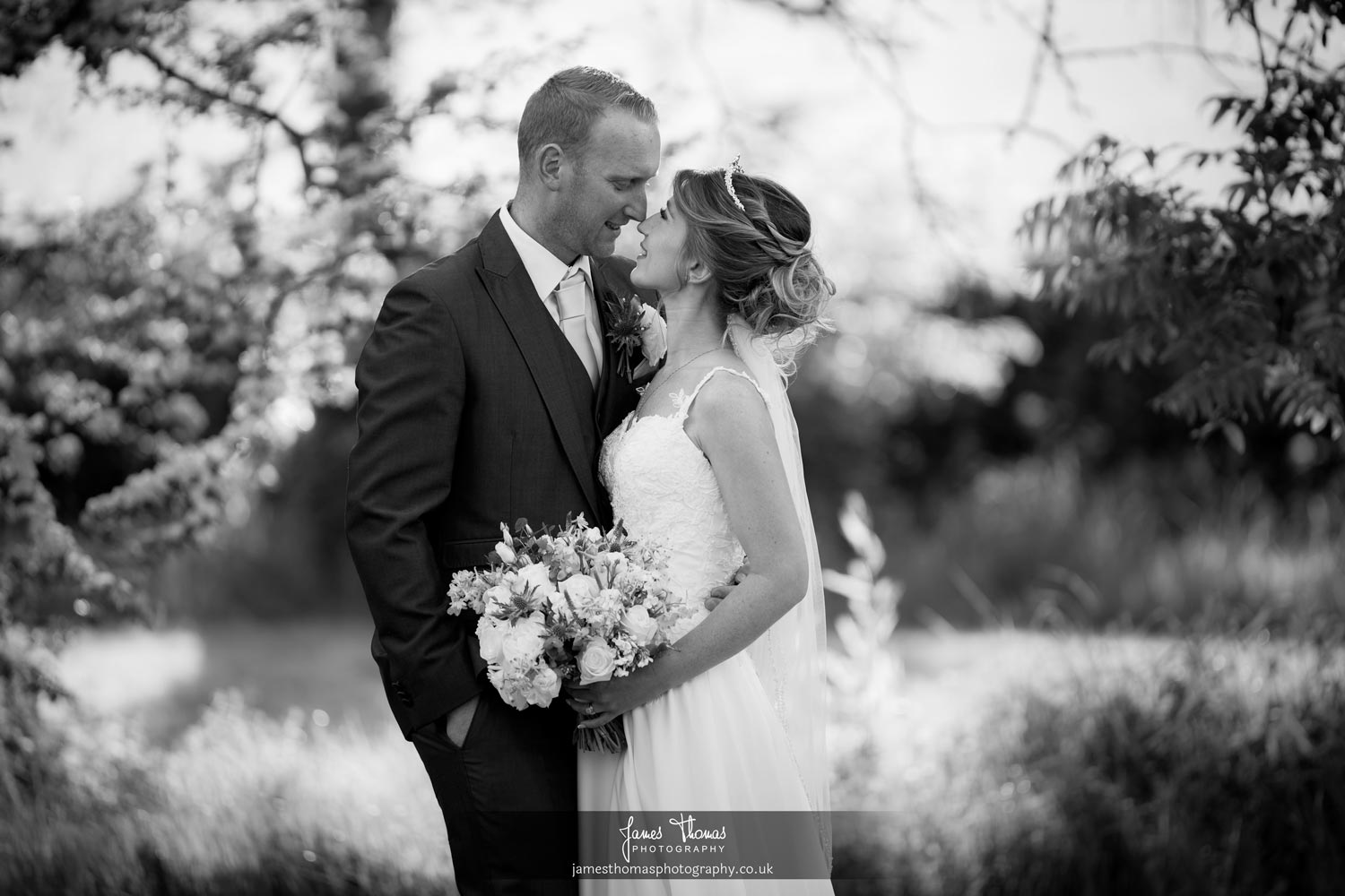 Bride and groom portrait in the gardens at The White Hart in Great Yeldham