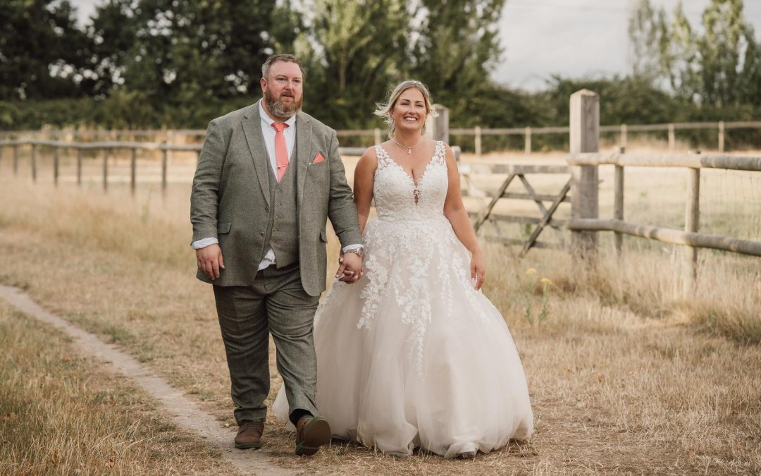 Married couple walking hand in hand at The Canary Shed